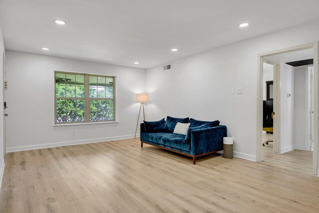 7718 Royal Ln Unit 214, Dallas, TX 75230 - sitting room featuring light wood finished floors, baseboards, and recessed lighting