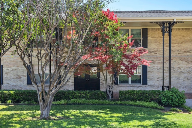 7718 Royal Ln Unit 214, Dallas, TX 75230 - view of front of house featuring a front lawn and brick siding