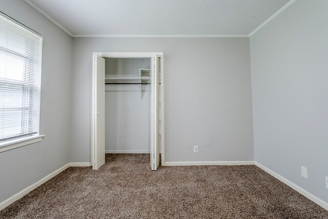 5729 Wales Ave, Fort Worth, TX 76133 - unfurnished bedroom with carpet, ornamental molding, multiple windows, baseboards, and a closet