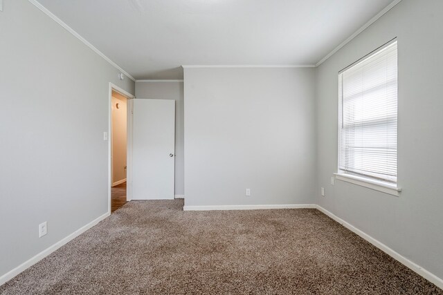 5729 Wales Ave, Fort Worth, TX 76133 - carpeted spare room featuring crown molding and baseboards