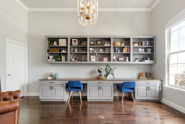 1008 Cason Falls Rd, Mckinney, TX 75071 - home office featuring built in desk, a chandelier, plenty of natural light, dark wood-type flooring, and crown molding