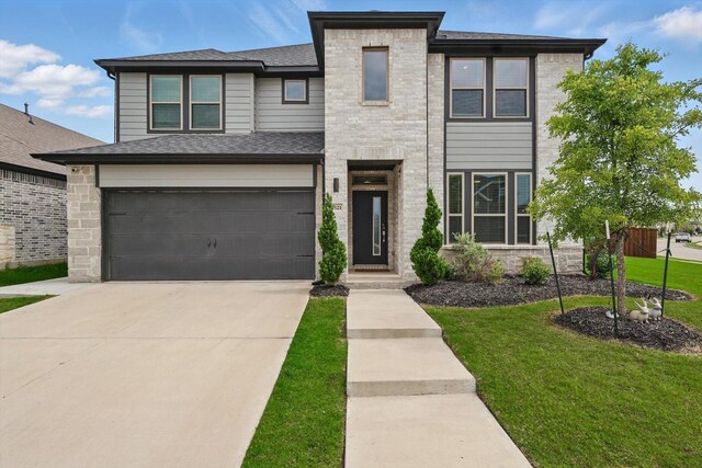 2321 Spring Side Dr, Royse City, TX 75189 - view of front of home with concrete driveway, an attached garage, a front yard, and a shingled roof