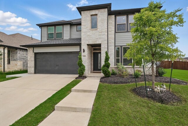 2321 Spring Side Dr, Royse City, TX 75189 - view of front of property with concrete driveway and a garage