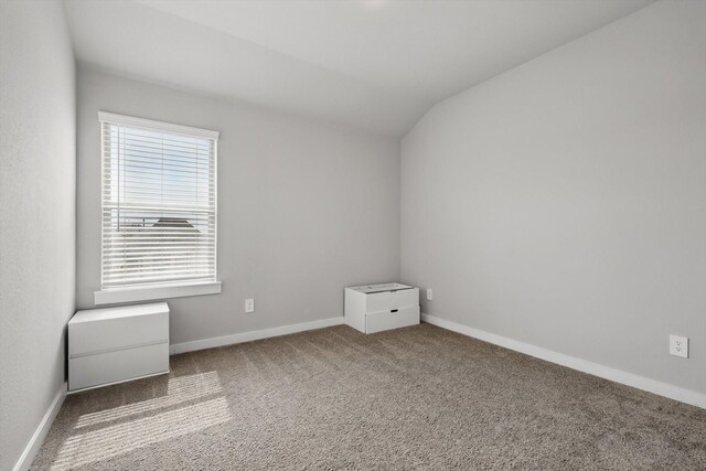 2321 Spring Side Dr, Royse City, TX 75189 - spare room with lofted ceiling, carpet flooring, and baseboards