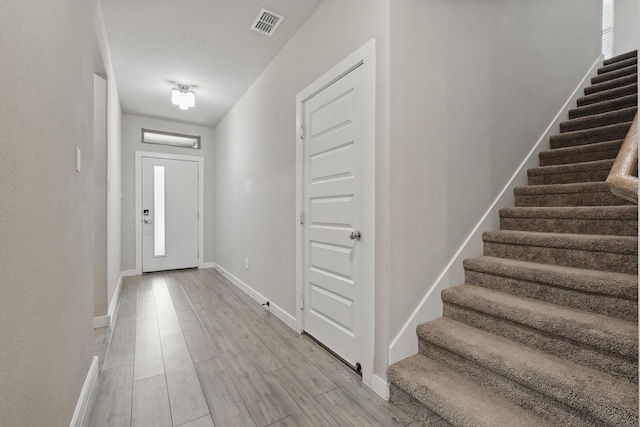 2321 Spring Side Dr, Royse City, TX 75189 - foyer with stairs, light wood finished floors, and baseboards