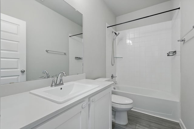 2321 Spring Side Dr, Royse City, TX 75189 - bathroom featuring toilet, vanity,  shower combination, and wood finished floors