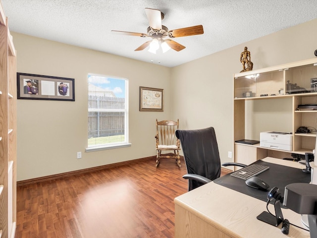 10117 High Bluff Dr, Fort Worth, TX 76108 - office area featuring wood finished floors, a ceiling fan, a textured ceiling, and baseboards
