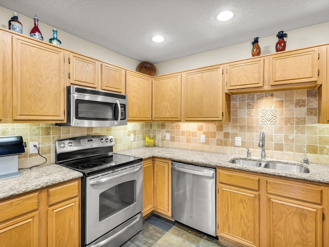 10117 High Bluff Dr, Fort Worth, TX 76108 - kitchen with stainless steel appliances, a sink, a textured ceiling, light stone counters, and tasteful backsplash
