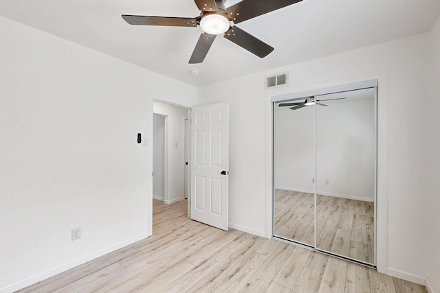 3558 La Prada Dr, Mesquite, TX 75150 - unfurnished bedroom featuring wood finished floors, baseboards, a closet, and a ceiling fan