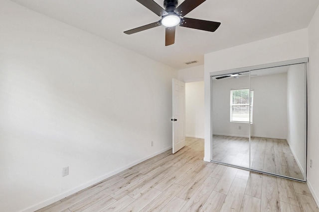 3558 La Prada Dr, Mesquite, TX 75150 - unfurnished bedroom with light wood-style flooring, baseboards, a closet, and ceiling fan