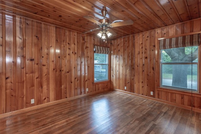 501 Lynch St, Gainesville, TX 76240 - spare room featuring wood ceiling, healthy amount of natural light, wood finished floors, baseboards, and wood walls