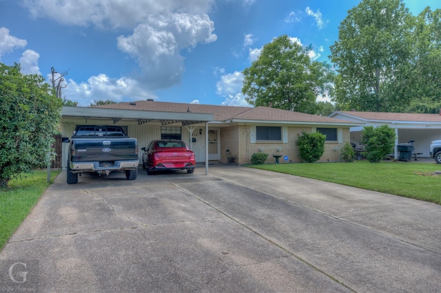 3415 Glasscock Ave, Bossier City, LA 71112 - ranch-style house with concrete driveway, a front lawn, brick siding, and an attached carport