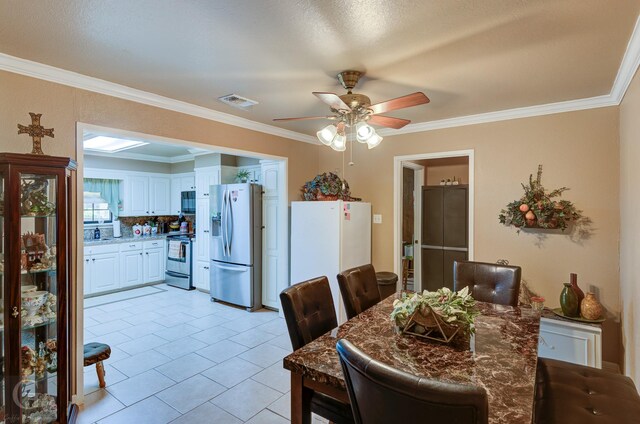 3415 Glasscock Ave, Bossier City, LA 71112 - dining area with a ceiling fan, crown molding, and light tile patterned floors
