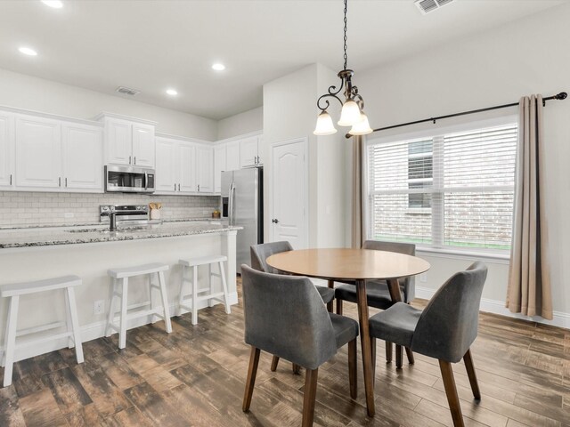 11716 Pistachio Trl, Fort Worth, TX 76108 - dining room featuring dark wood-type flooring, recessed lighting, and a chandelier