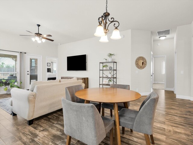 11716 Pistachio Trl, Fort Worth, TX 76108 - dining area featuring dark wood finished floors, a ceiling fan, baseboards, and a chandelier