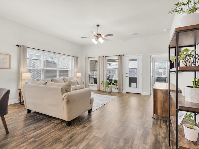 11716 Pistachio Trl, Fort Worth, TX 76108 - living room featuring ceiling fan, dark wood-type flooring, plenty of natural light, and baseboards
