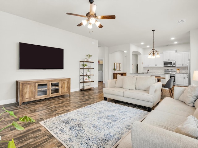 11716 Pistachio Trl, Fort Worth, TX 76108 - living area featuring arched walkways, dark wood-style flooring, ceiling fan, recessed lighting, and baseboards