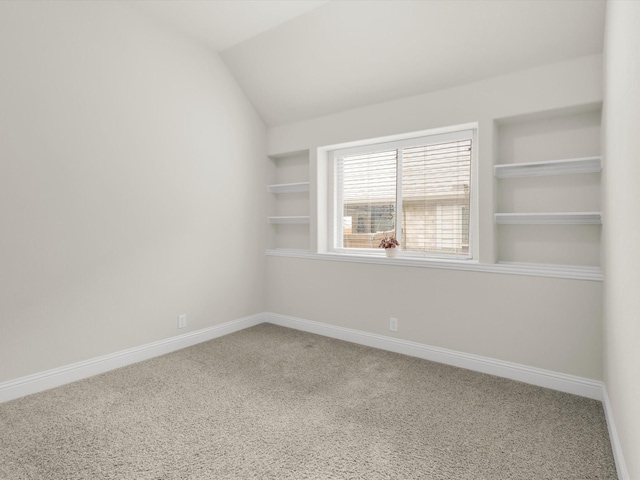 11716 Pistachio Trl, Fort Worth, TX 76108 - carpeted empty room with built in shelves, baseboards, and vaulted ceiling
