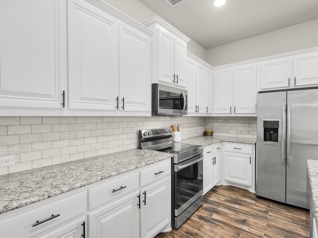 11716 Pistachio Trl, Fort Worth, TX 76108 - kitchen with appliances with stainless steel finishes, white cabinets, backsplash, dark wood-type flooring, and light stone counters