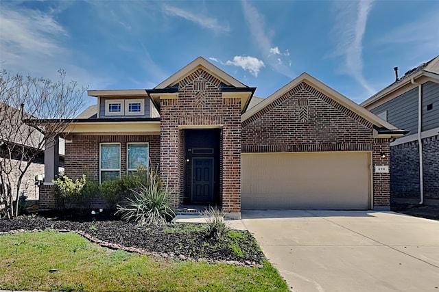 928 Dove Cv, Argyle, TX 76226 - view of front facade with brick siding, an attached garage, and driveway