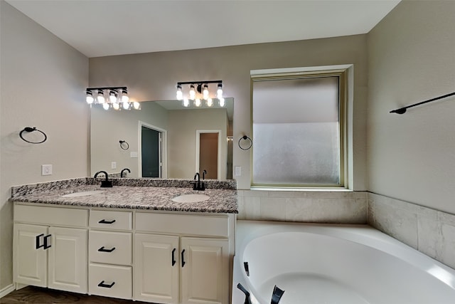 928 Dove Cv, Argyle, TX 76226 - bathroom featuring double vanity and a garden tub