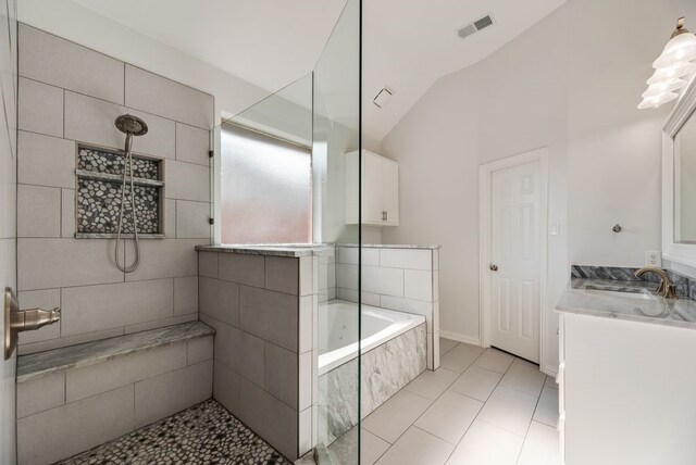 1401 Superior Dr, Flower Mound, TX 75028 - full bathroom featuring lofted ceiling, a bath, vanity, tiled shower, and tile patterned flooring