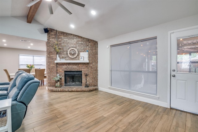 1316 Devonshire Ln, Mesquite, TX 75150 - living room featuring ceiling fan, wood finished floors, and a fireplace