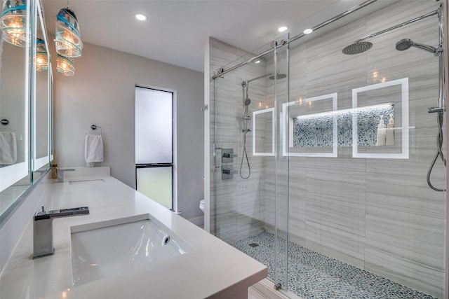 1316 Devonshire Ln, Mesquite, TX 75150 - bathroom featuring a shower stall, double vanity, toilet, and recessed lighting