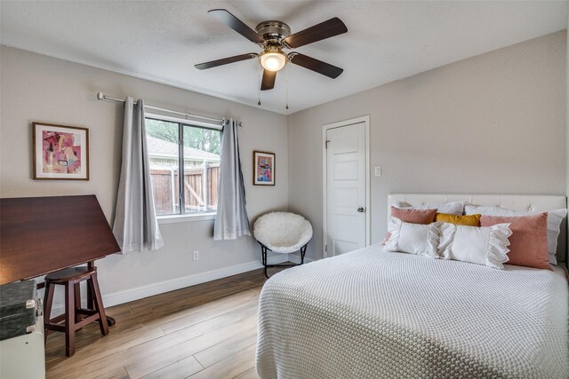 1316 Devonshire Ln, Mesquite, TX 75150 - bedroom with wood finished floors, baseboards, and ceiling fan