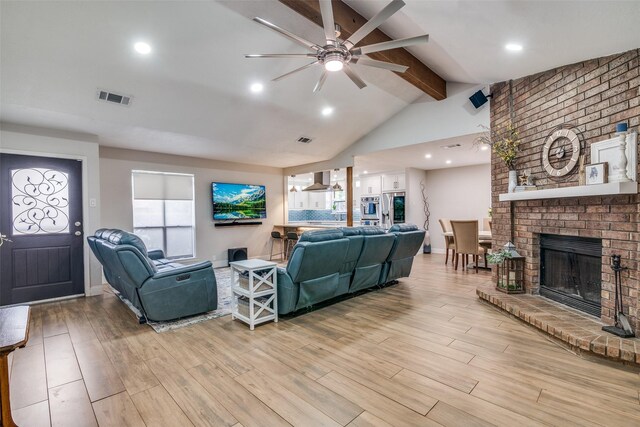 1316 Devonshire Ln, Mesquite, TX 75150 - living room featuring a ceiling fan, light wood-type flooring, a brick fireplace, plenty of natural light, and recessed lighting
