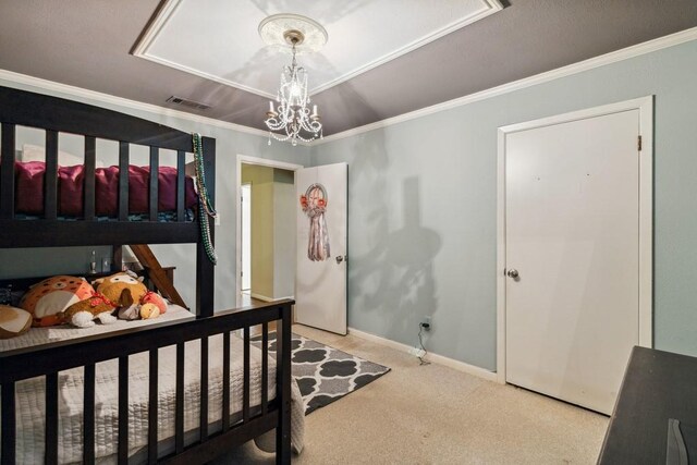 2916 Lafayette St, Corsicana, TX 75110 - bedroom with carpet flooring, crown molding, baseboards, and a chandelier