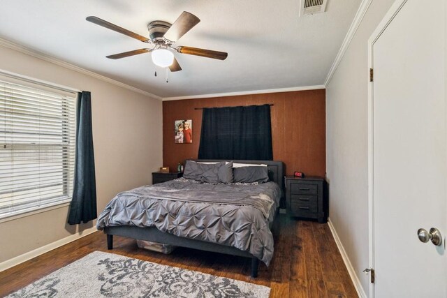 2916 Lafayette St, Corsicana, TX 75110 - bedroom with wood finished floors, crown molding, baseboards, and ceiling fan