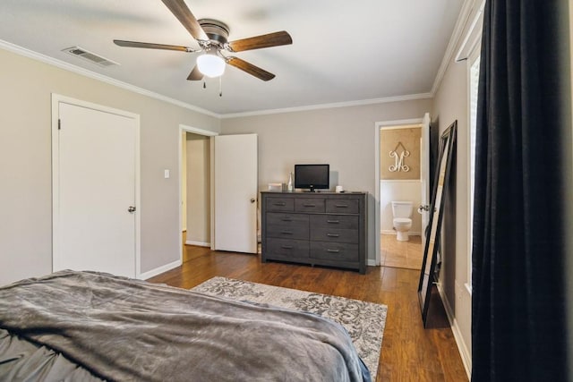 2916 Lafayette St, Corsicana, TX 75110 - bedroom with crown molding, dark wood finished floors, ceiling fan, and baseboards