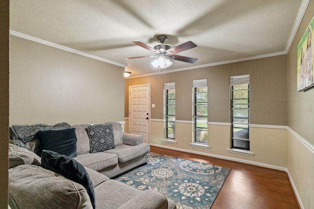 2916 Lafayette St, Corsicana, TX 75110 - living room with wood finished floors, a ceiling fan, baseboards, and crown molding