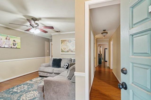 2916 Lafayette St, Corsicana, TX 75110 - living room with ornamental molding, ceiling fan, wood finished floors, and baseboards