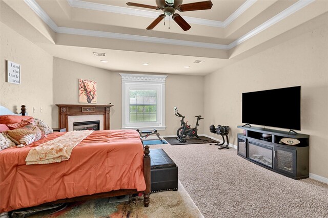 30 Tananger Springs Dr, Denison, TX 75021 - carpeted bedroom with ornamental molding, a glass covered fireplace, ceiling fan, and baseboards