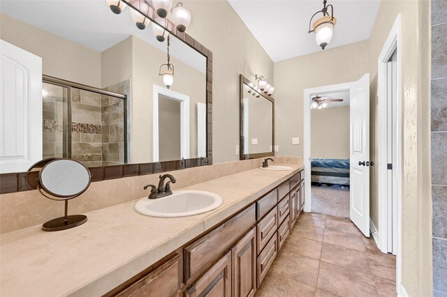 30 Tananger Springs Dr, Denison, TX 75021 - ensuite bathroom with double vanity, ceiling fan, a shower stall, and tile patterned floors
