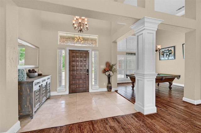 30 Tananger Springs Dr, Denison, TX 75021 - entrance foyer featuring a chandelier, ornate columns, plenty of natural light, and baseboards
