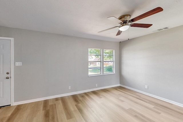 2530 Gerry Way St, Lancaster, TX 75134 - spare room with light wood-style flooring, ceiling fan, and baseboards