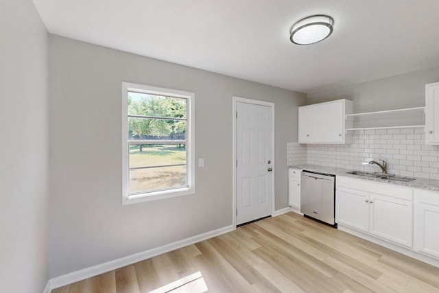 2530 Gerry Way St, Lancaster, TX 75134 - kitchen with dishwasher, open shelves, a sink, light stone countertops, and light wood-style flooring