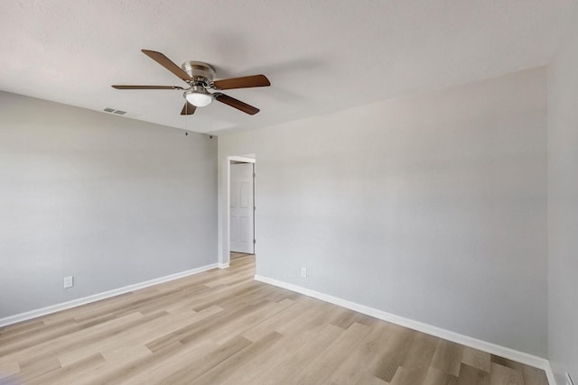 2530 Gerry Way St, Lancaster, TX 75134 - empty room with ceiling fan, light wood-style flooring, and baseboards