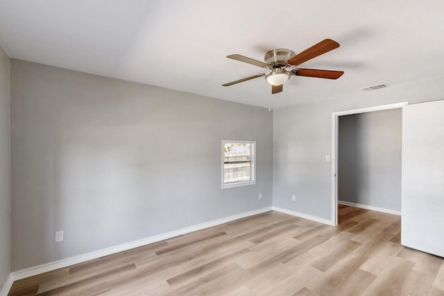2530 Gerry Way St, Lancaster, TX 75134 - unfurnished room with light wood-style flooring, a ceiling fan, and baseboards