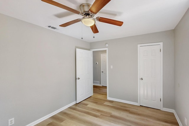 2530 Gerry Way St, Lancaster, TX 75134 - unfurnished bedroom featuring light wood-style flooring, baseboards, and ceiling fan
