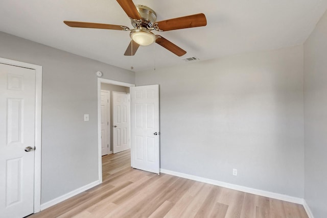 2530 Gerry Way St, Lancaster, TX 75134 - unfurnished bedroom featuring light wood finished floors, baseboards, and ceiling fan