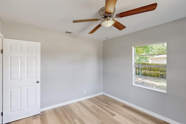 2530 Gerry Way St, Lancaster, TX 75134 - empty room featuring light wood-style flooring, a ceiling fan, and baseboards