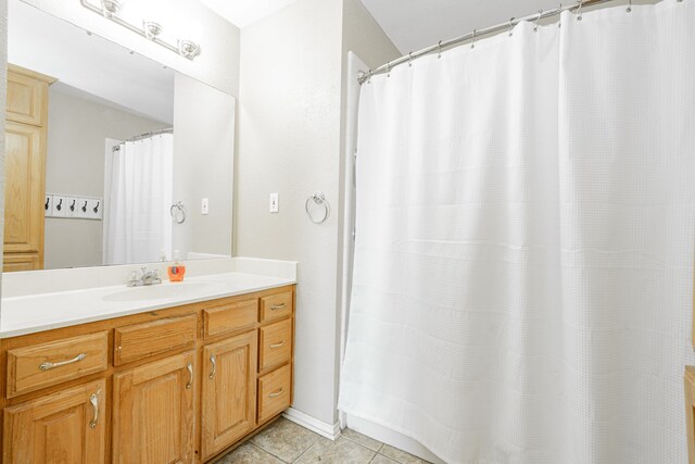 9390 Adams St, Terrell, TX 75160 - bathroom featuring tile patterned flooring, vanity, and curtained shower