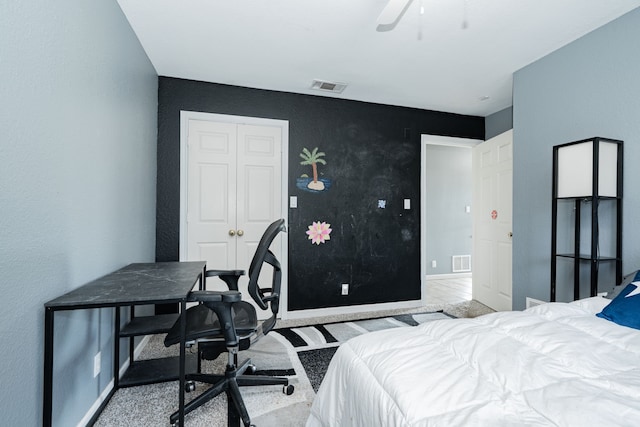 9390 Adams St, Terrell, TX 75160 - bedroom with an office area, a textured wall, baseboards, ceiling fan, and carpet