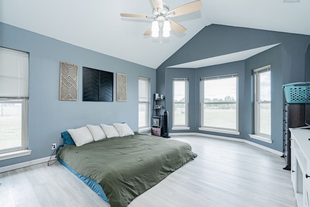 9390 Adams St, Terrell, TX 75160 - bedroom featuring wood finished floors, lofted ceiling, multiple windows, baseboards, and ceiling fan