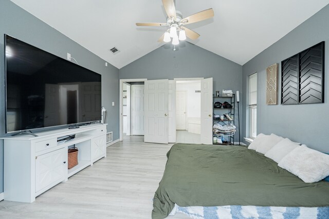 9390 Adams St, Terrell, TX 75160 - bedroom featuring light wood-style floors, vaulted ceiling, ensuite bath, and ceiling fan