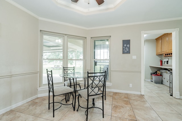 9390 Adams St, Terrell, TX 75160 - dining room with ceiling fan, a raised ceiling, crown molding, light tile patterned floors, and baseboards